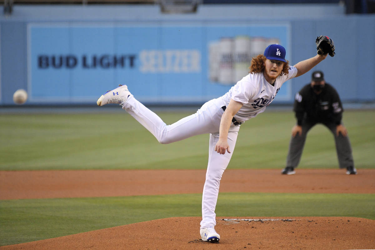 Los Angeles Dodgers starting pitcher Dustin May throws to the plate during the first inning of ...