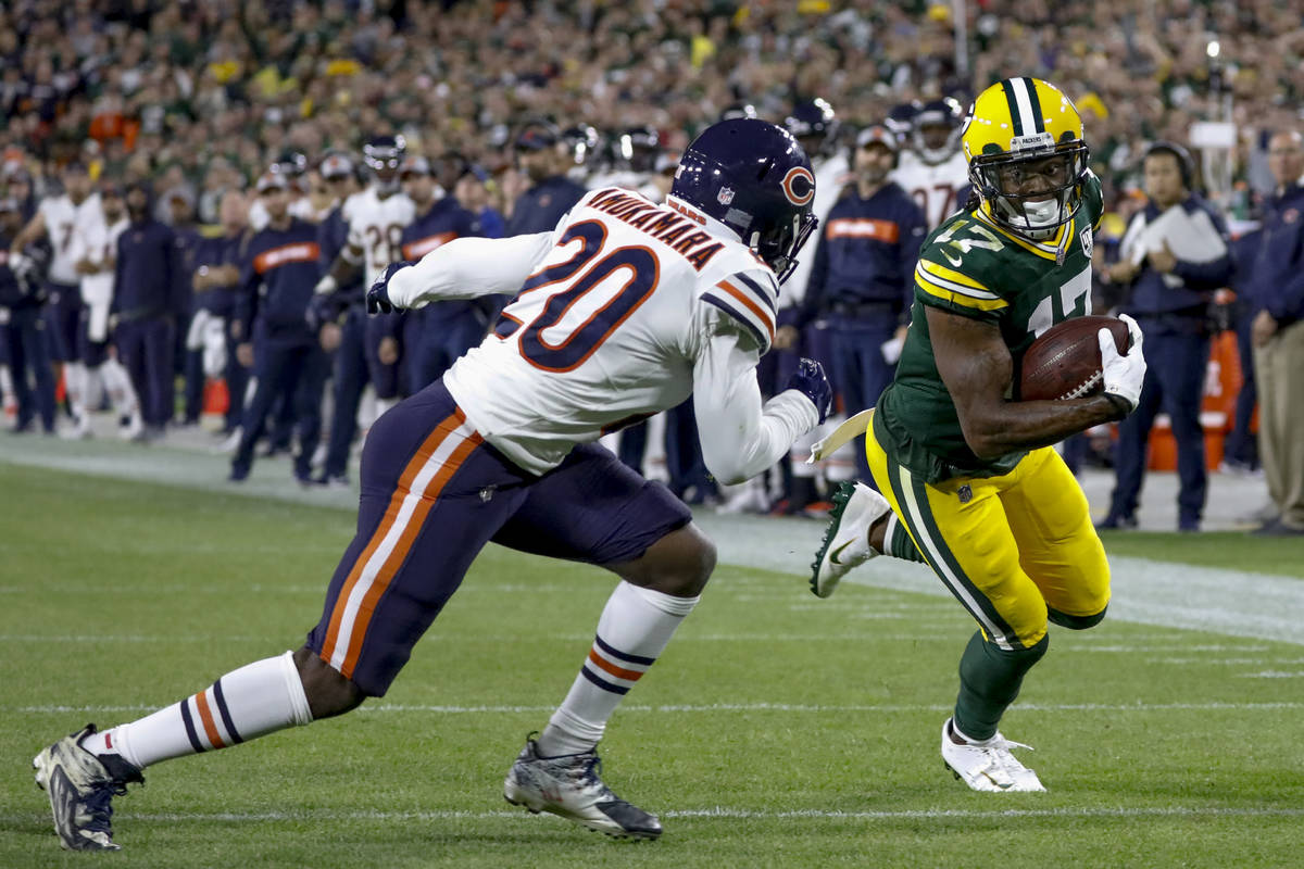 Green Bay Packers' Davante Adams catches a touchdown pass with Chicago Bears' Prince Amukamara ...