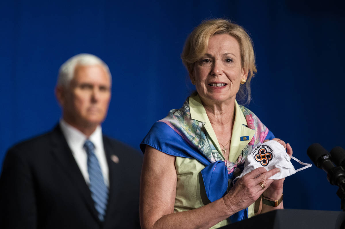 Vice President Mike Pence, left, listens as White House coronavirus response coordinator Dr. De ...