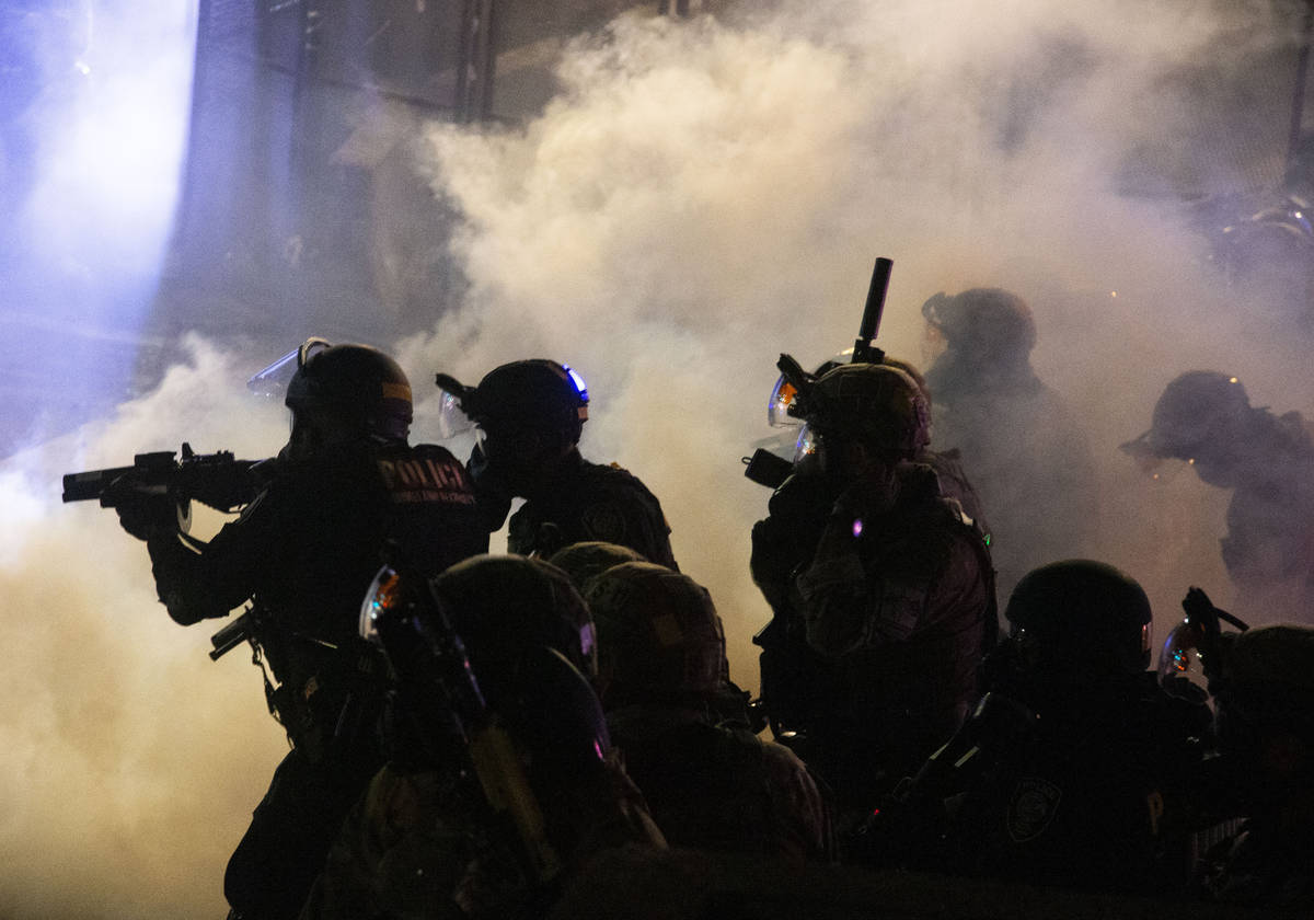 Federal officers use chemical irritants and projectiles to disperse Black Lives Matter proteste ...