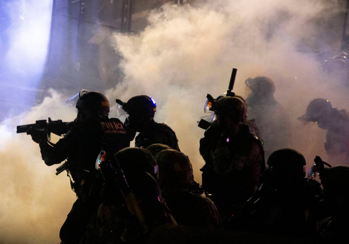 Federal officers use chemical irritants and projectiles to disperse Black Lives Matter proteste ...