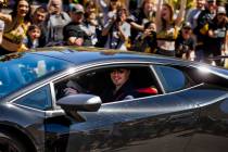 Golden Knights goaltender Marc-Andre Fleury smiles at fans while players depart City National A ...