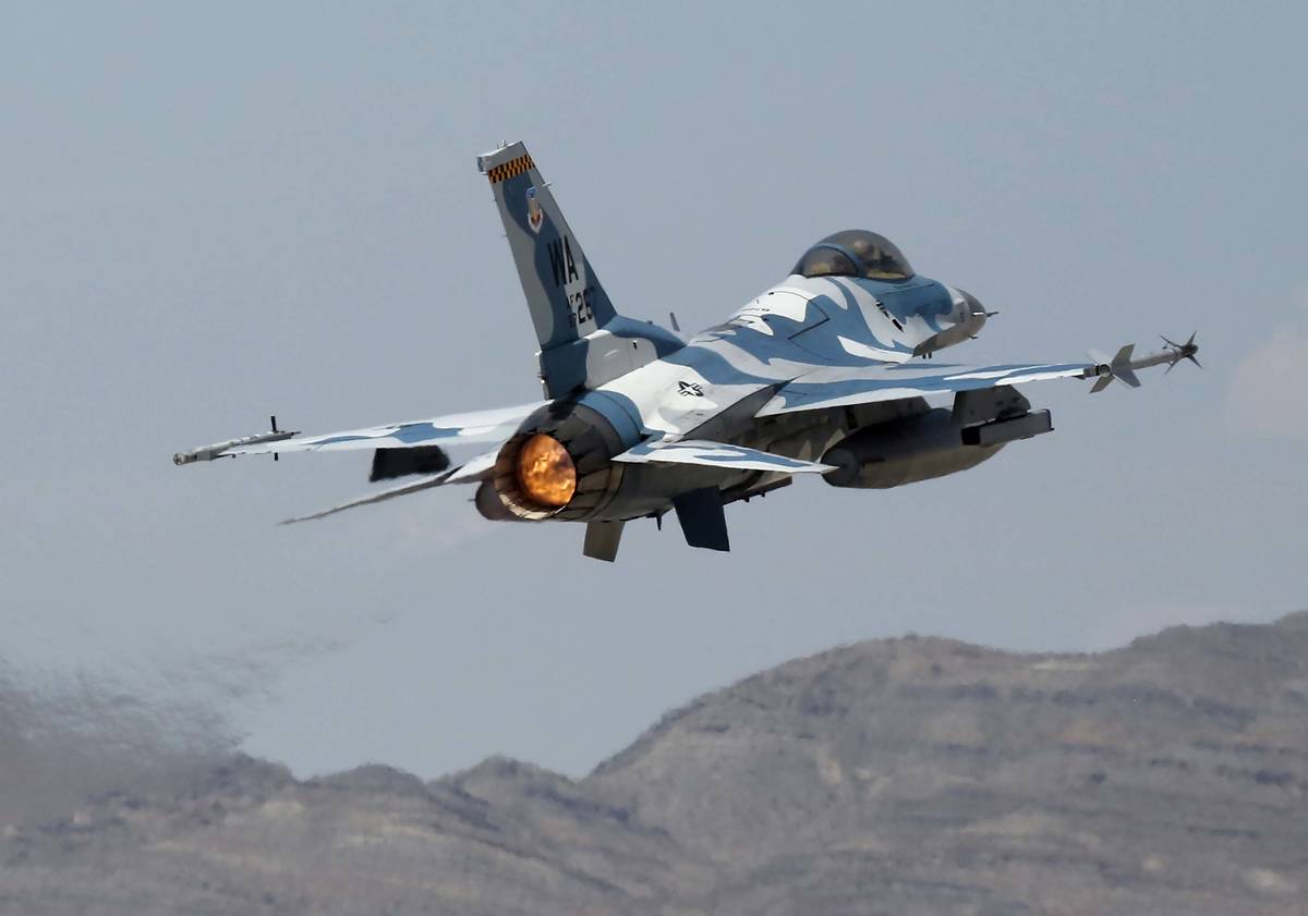An F-16 aggressor jet takes off from Nellis Air Force Base for a training flight on Wednesday, ...