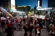 People participate during a Black Lives Matter rally on the Las Vegas Strip on Saturday, July 2 ...