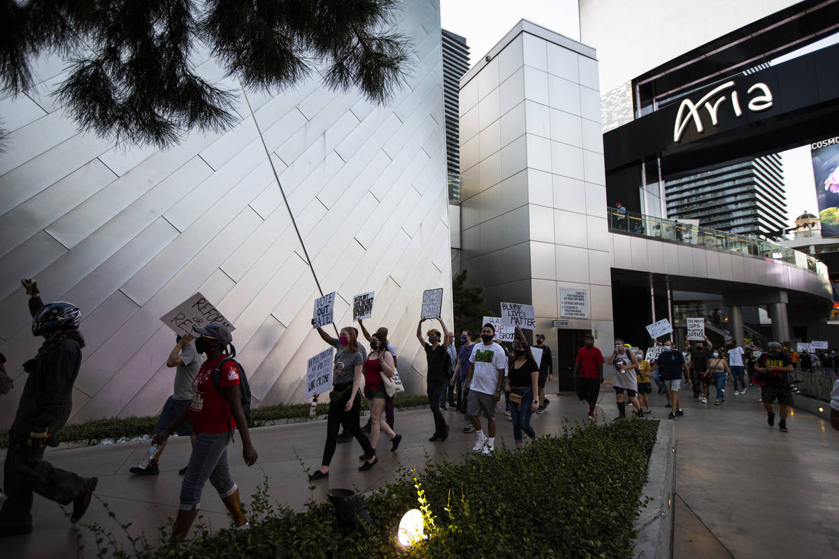 People participate during a Black Lives Matter rally on the Las Vegas Strip on Saturday, July 2 ...