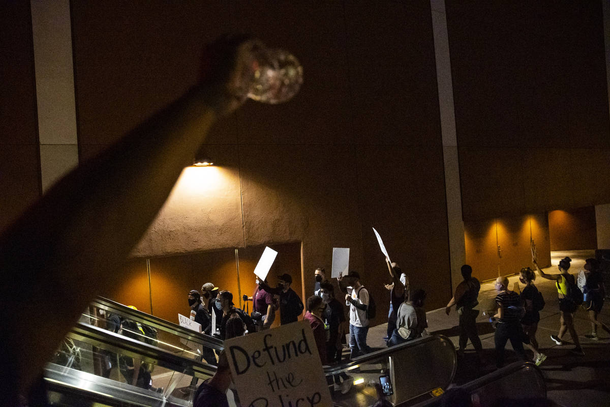 People participate during a Black Lives Matter rally on the Las Vegas Strip on Saturday, July 2 ...