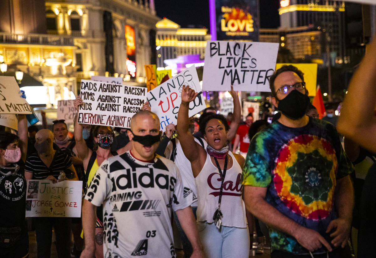 People march during a Black Lives Matter rally on the Las Vegas Strip on Saturday, July 25, 202 ...