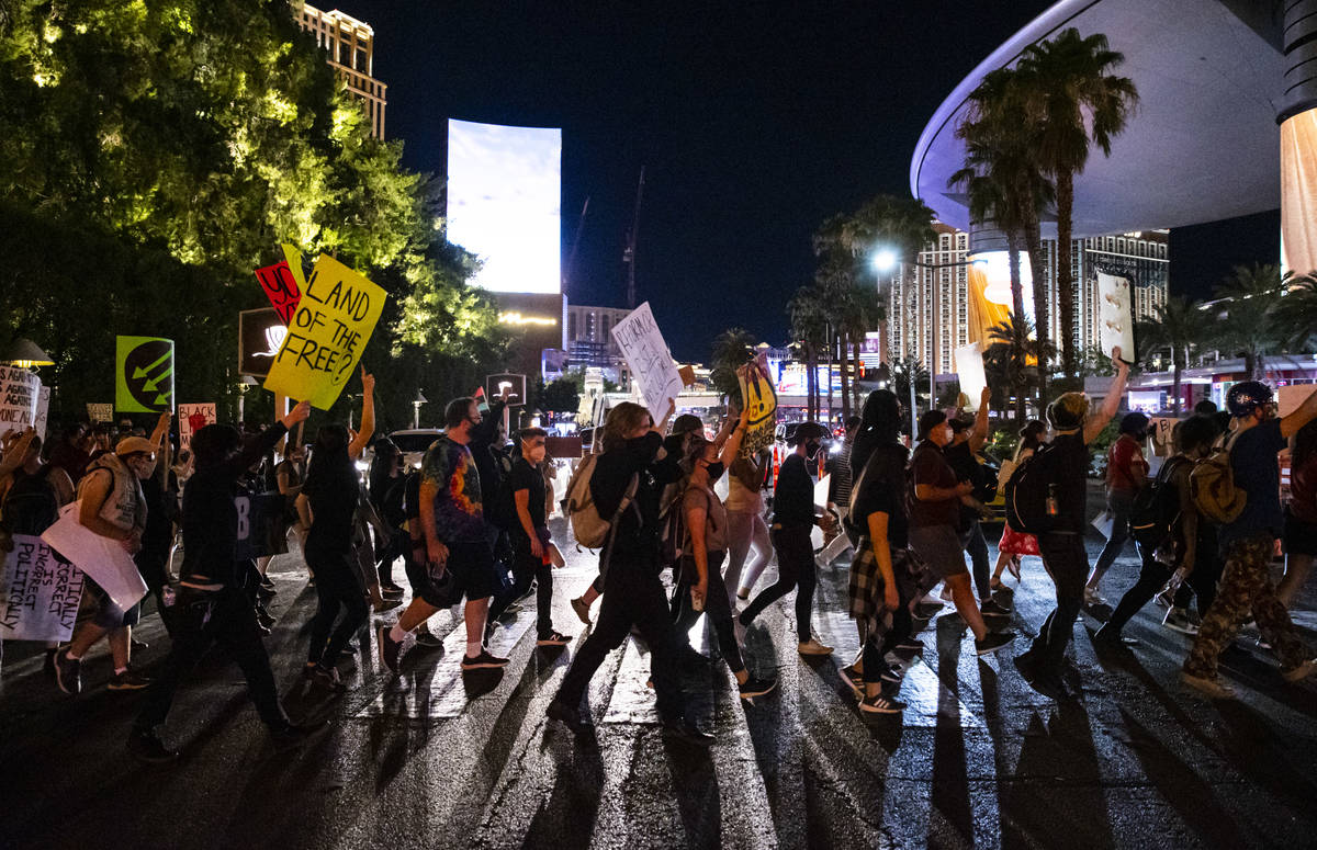 People march during a Black Lives Matter rally on the Las Vegas Strip on Saturday, July 25, 202 ...