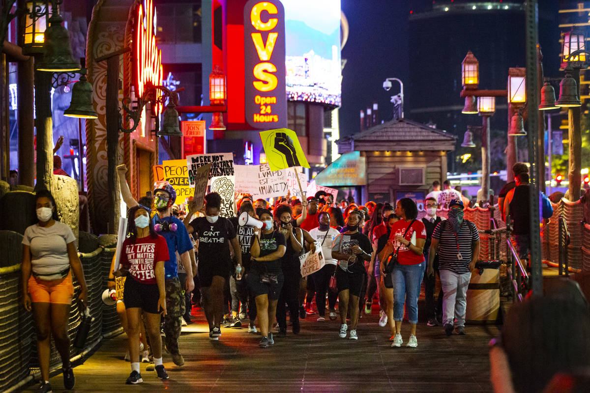 People march during a Black Lives Matter rally on the Las Vegas Strip on Saturday, July 25, 202 ...