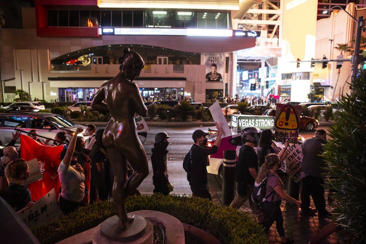 People march during a Black Lives Matter rally on the Las Vegas Strip on Saturday, July 25, 202 ...