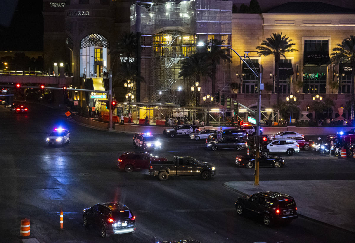 Las Vegas police gather nearby during a Black Lives Matter rally on the Las Vegas Strip on Satu ...