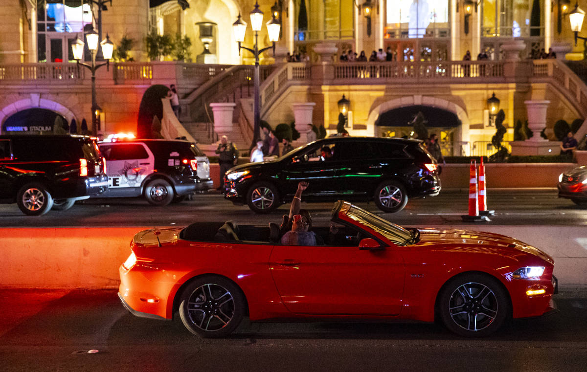 People in a car cheer during a Black Lives Matter rally on the Las Vegas Strip on Saturday, Jul ...