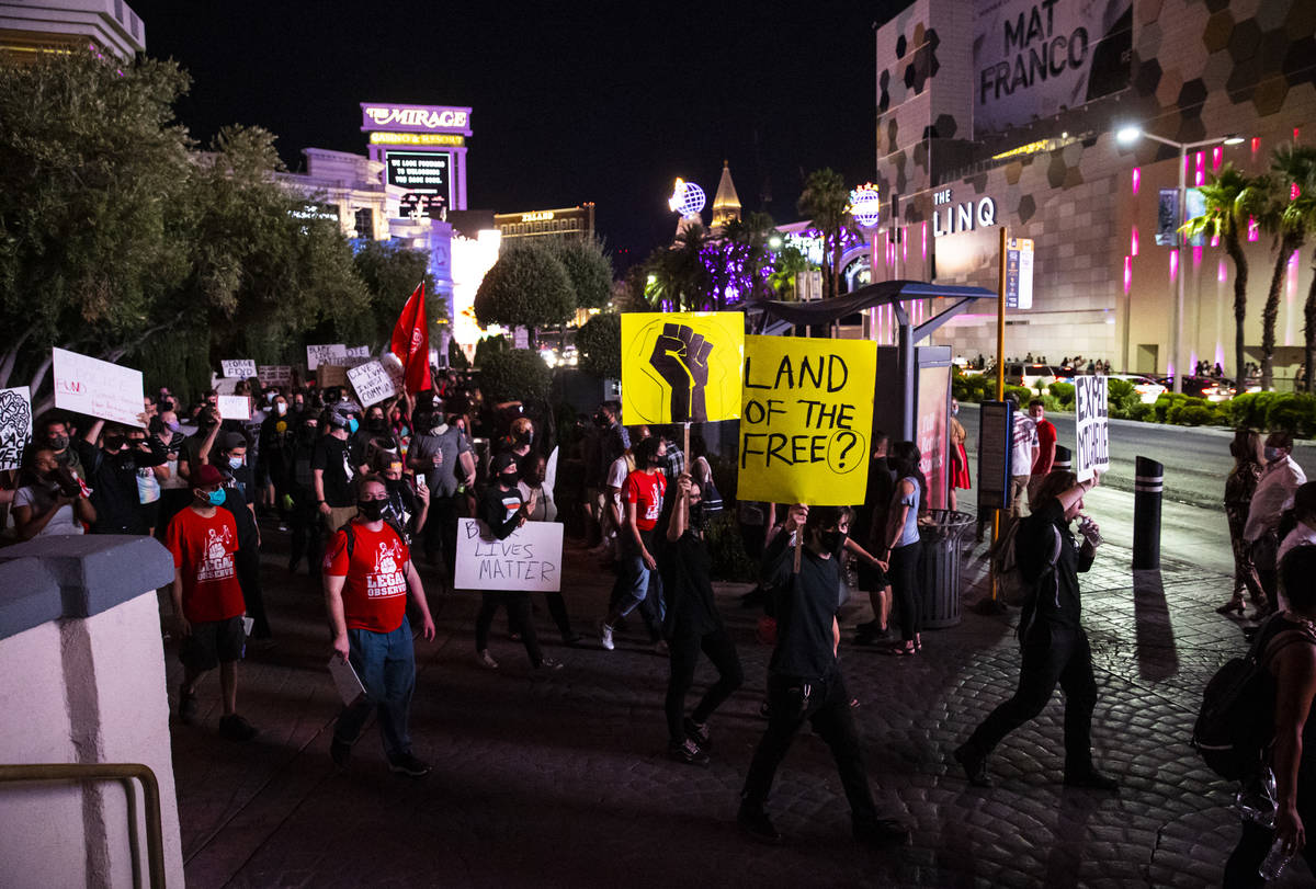 People march during a Black Lives Matter rally on the Las Vegas Strip on Saturday, July 25, 202 ...