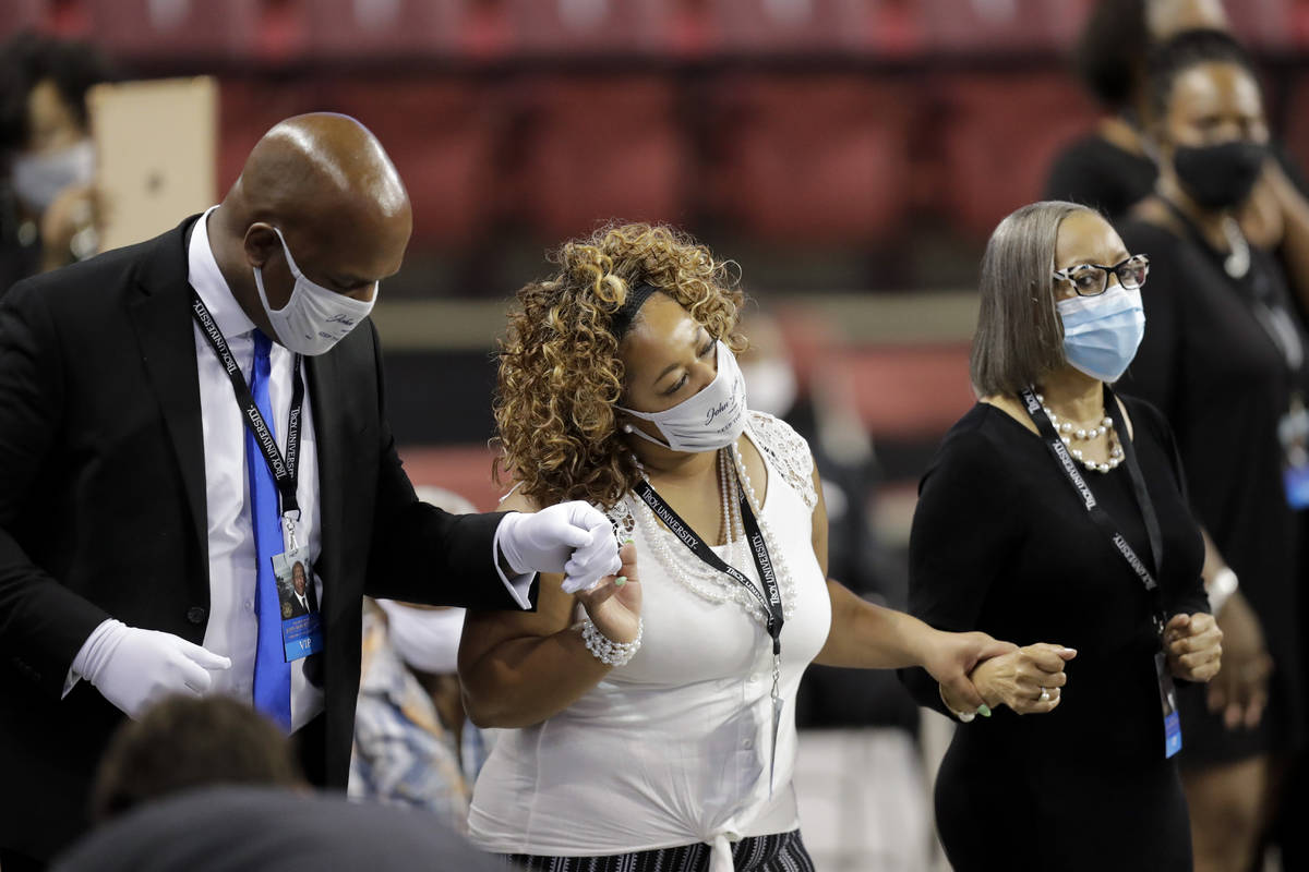 Mourners sing during the service for the late Rep. John Lewis, D-Ga., at Troy University on Sat ...