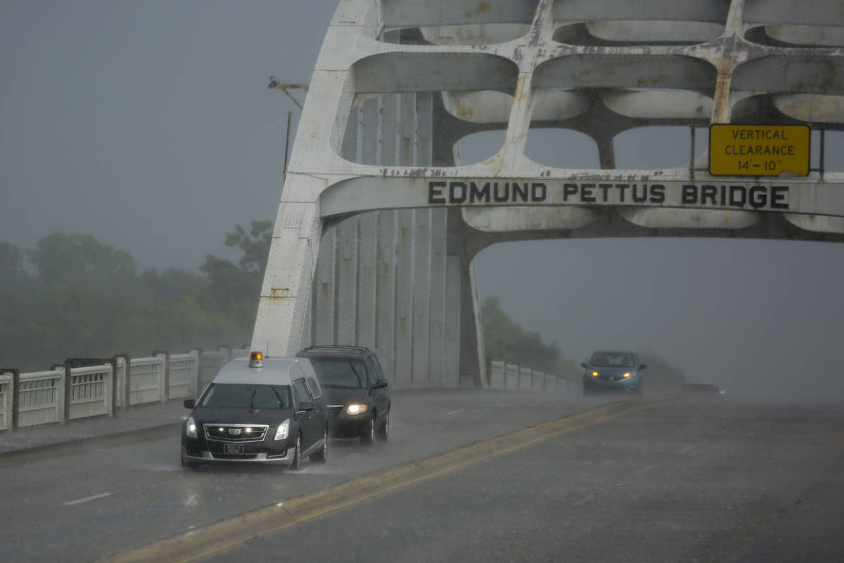A hearse carrying the casket of the late Rep. John Lewis, D-Ga., drives over the Edmund Pettus ...