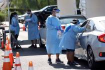 UNLV Medicine certified medical assistants and Nevada National Guard members test curbside for ...