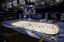 The Pittsburgh Penguins, left, and Philadelphia Flyers warm up before an exhibition NHL hockey ...