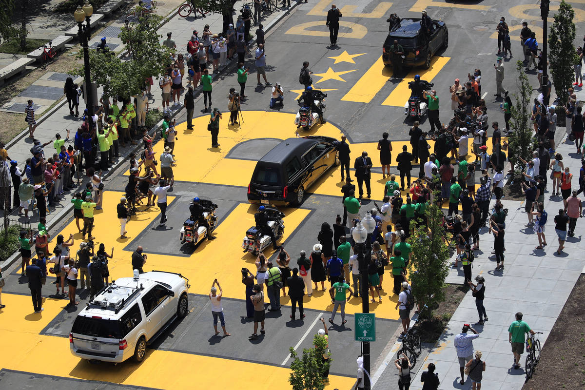 The hearse carrying the late Rep. John Lewis, D-Ga., moves along a section of 16th Street that' ...