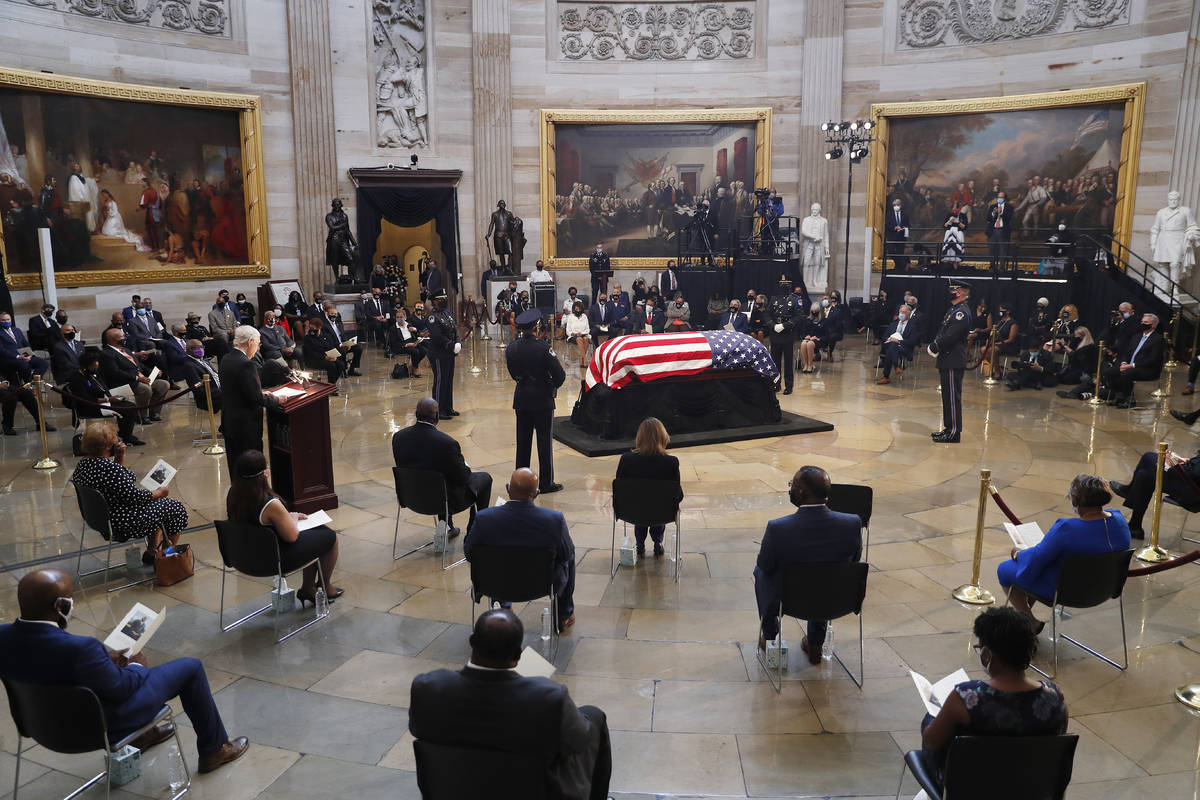 Senate Majority Leader Mitch McConnell of Ky., speaks during a memorial service as the flag-dra ...