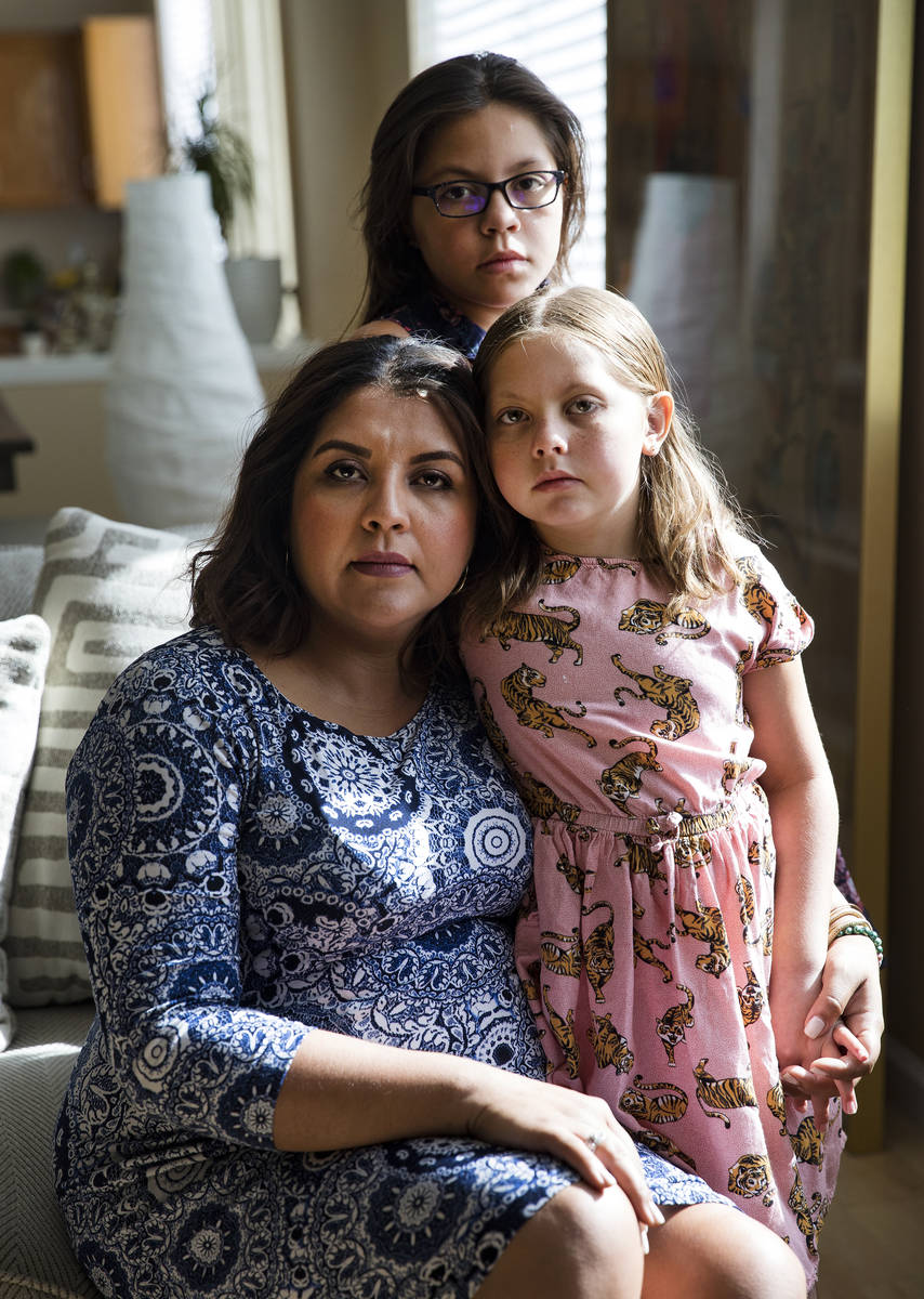 Adriana May-Azuero, from left, and her children, Jaise May, 7, front, and Sophia May, 11, at th ...