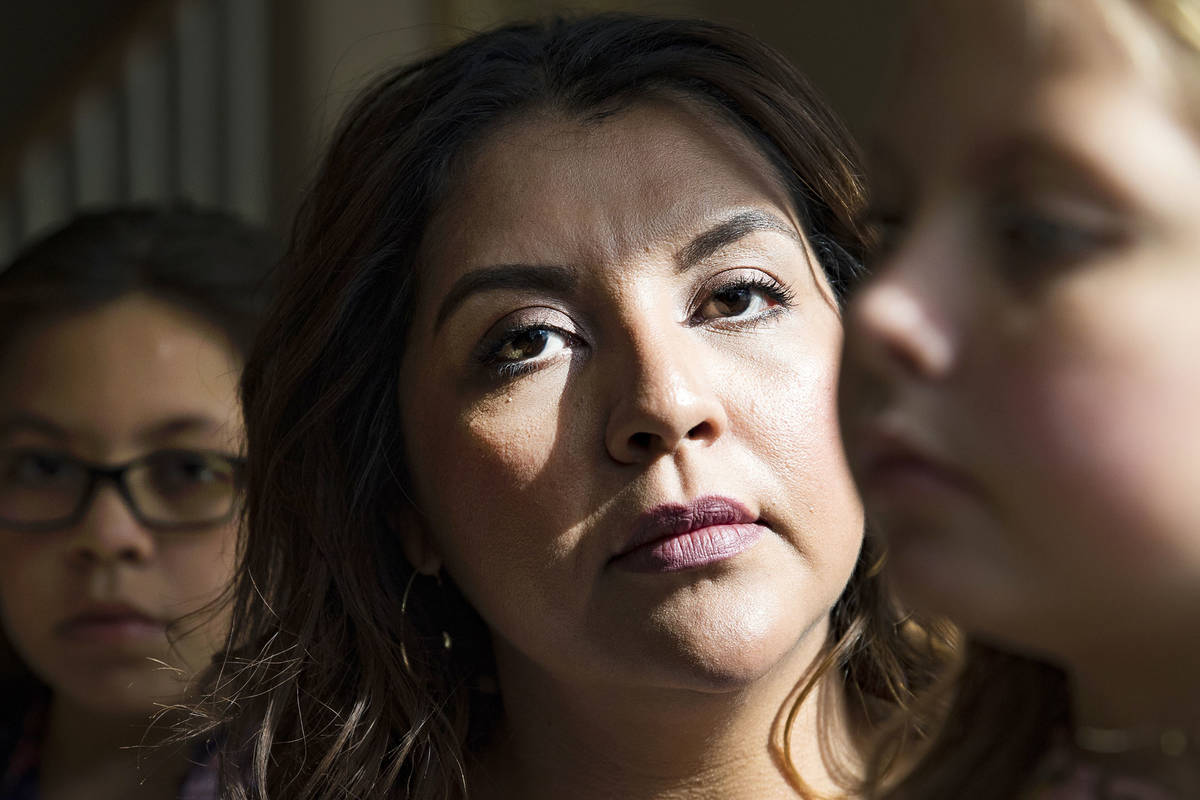 Adriana May-Azuero, center, and her children Sophia May, 11, left, and Jaise May, 7, at their h ...