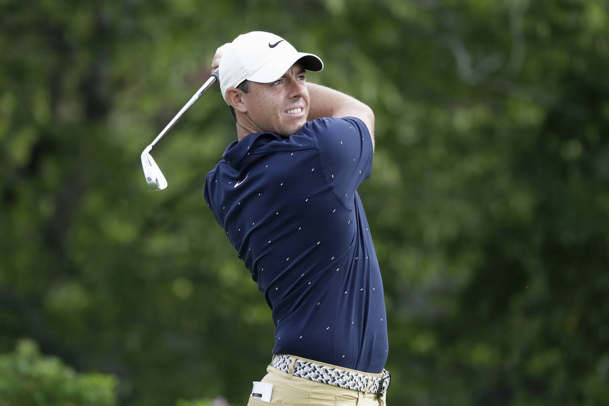 Rory McIlroy, of Northern Ireland, hits from the 14th tee during the second round of the Memori ...