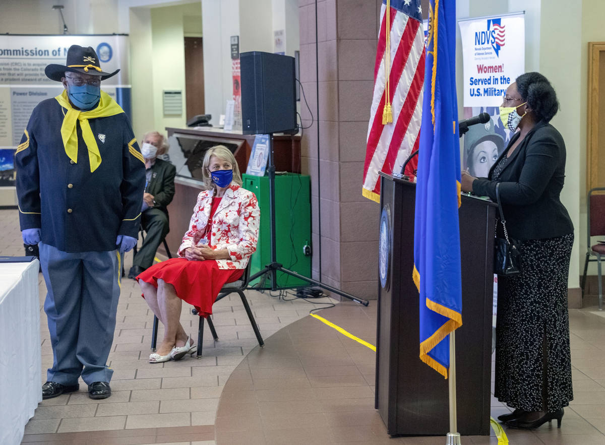 Vice president of Buffalo Soldiers Nevada Jon Jon Everet, left, listens asʁshanti McGee, ...