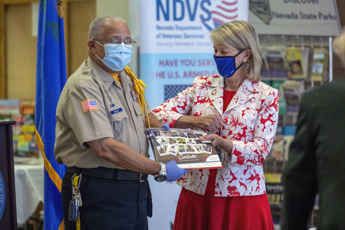 Senior Master Sgt. Richard Walker is honored by Nevada Secretary of State Barbara Cegavske duri ...