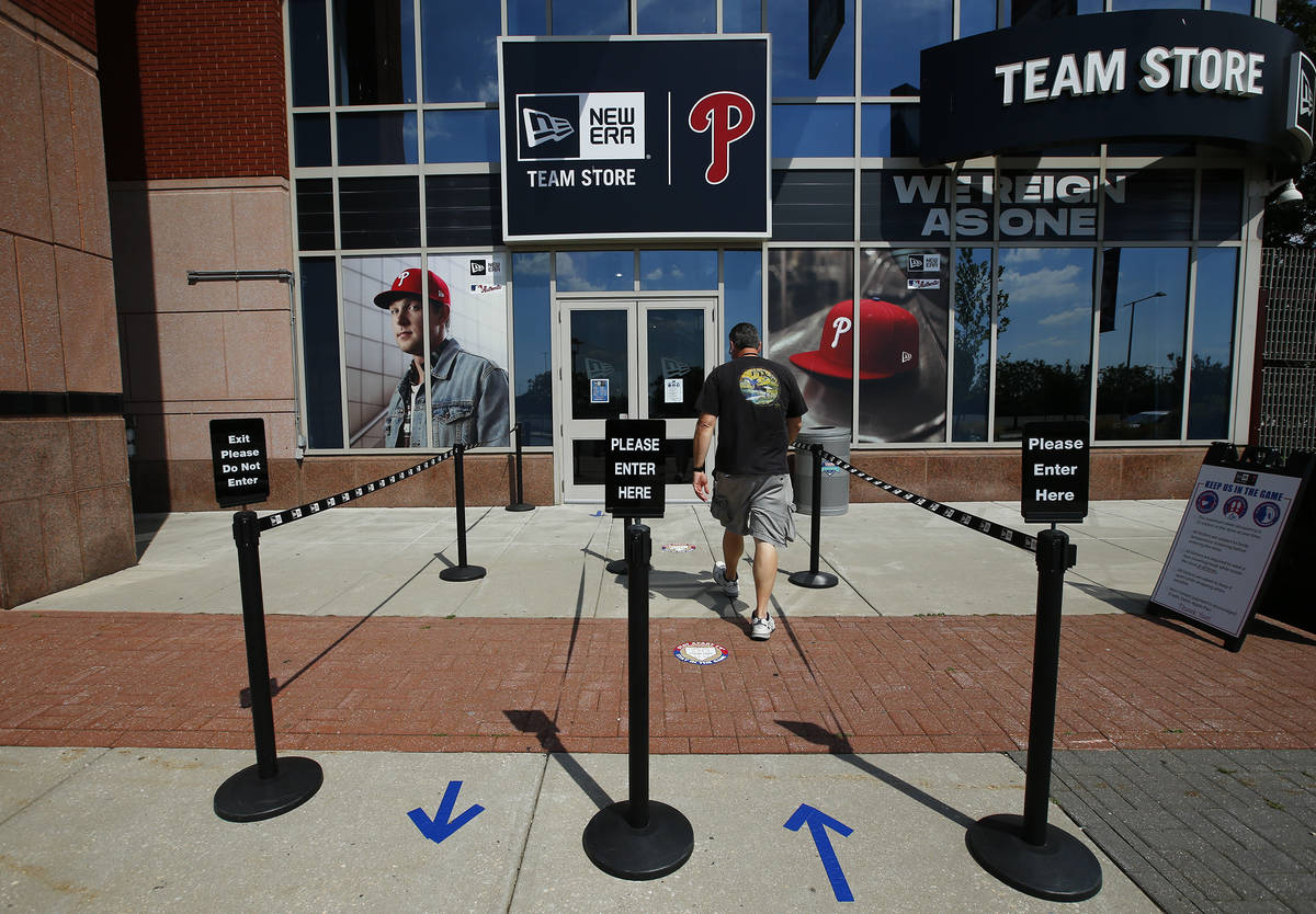 A person walks toward the Philadelphia Phillies team store at Citizens Bank Park on Monday, Jul ...