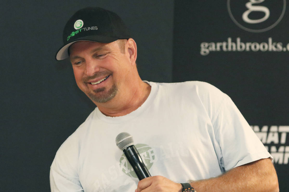 Country music star Garth Brooks answers questions about his world tour during a news conference ...