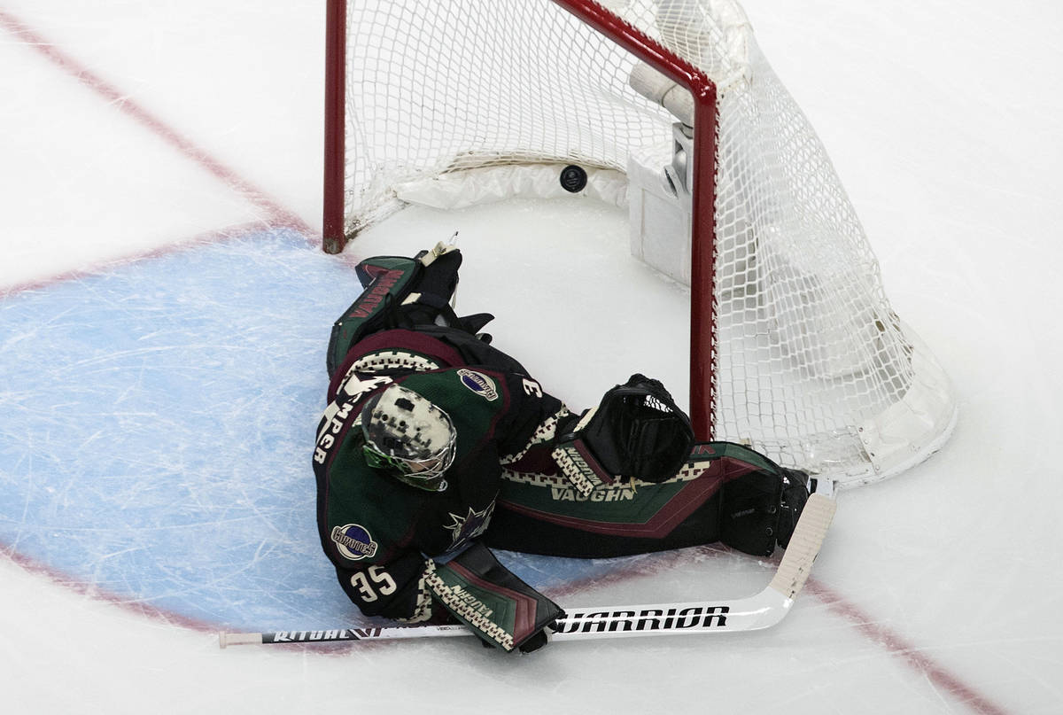 Arizona Coyotes' goalie Darcy Kuemper (35) is scored on by the Vegas Golden Knights during the ...