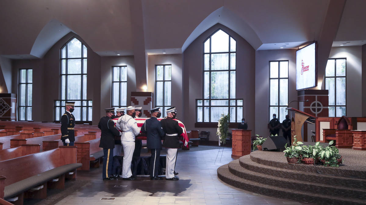 Members of an Honor Guard place the casket of the late Rep. John Lewis, D-Ga., for the funeral ...