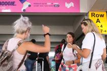 Erika Roxin, left, Izzy Navaro and Jaime Finnigan wait for their driver at ride-hailing compan ...