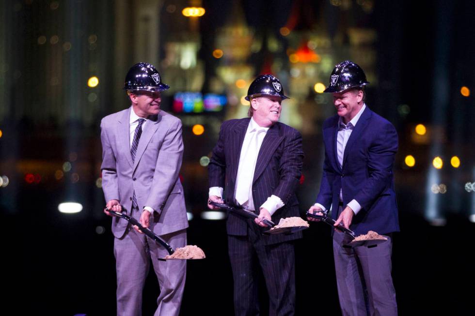 In this Nov. 13, 2017, file photo, Gov. Brian Sandoval, from left, Raiders owner Mark Davis, an ...