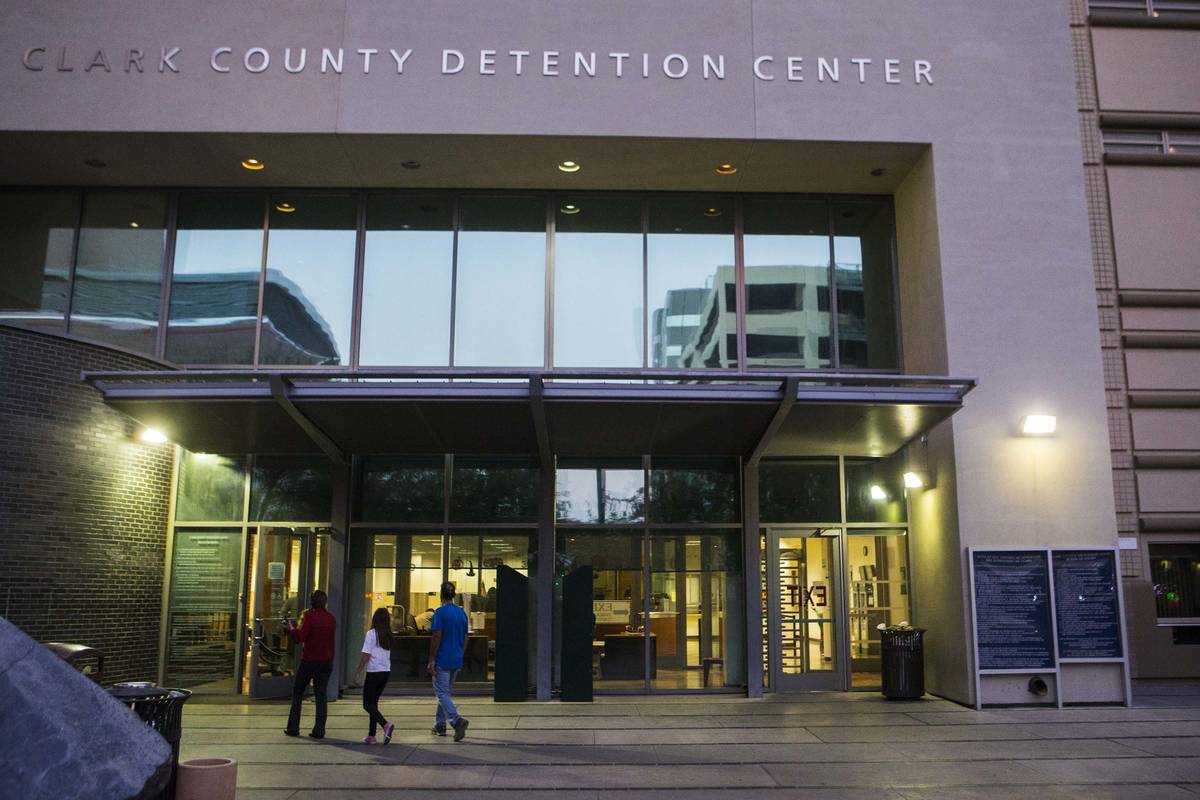 People walk outside of the Clark County Detention Center in downtown Las Vegas. (Chase Stevens/ ...