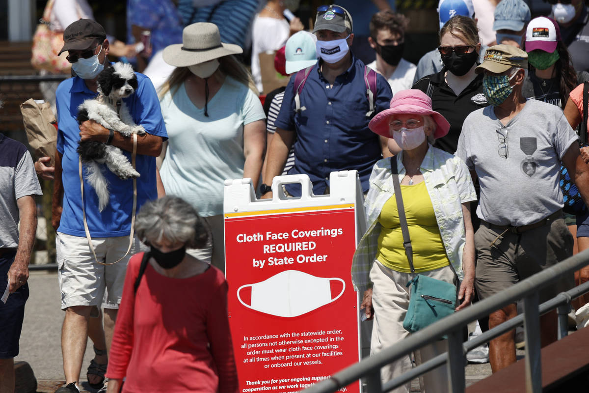 Passengers boards a Casco Bay Lines ferry bound for Peaks Island, Thursday, July 30, 2020, in P ...