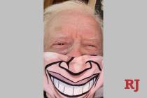 Jimmy Carter is shown wearing a customized face cover in a photo he sent to his friend and Bell ...