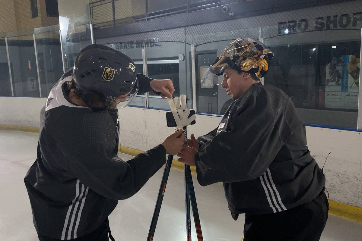 Golden Knights right wing Mark Stone and goaltender Marc-Andre Fleury tape an iPhone 11 Pro to ...