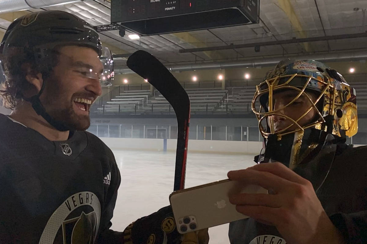 Fleury and Stone reviewing their Shot on iPhone footage during a break in the action in Las Veg ...