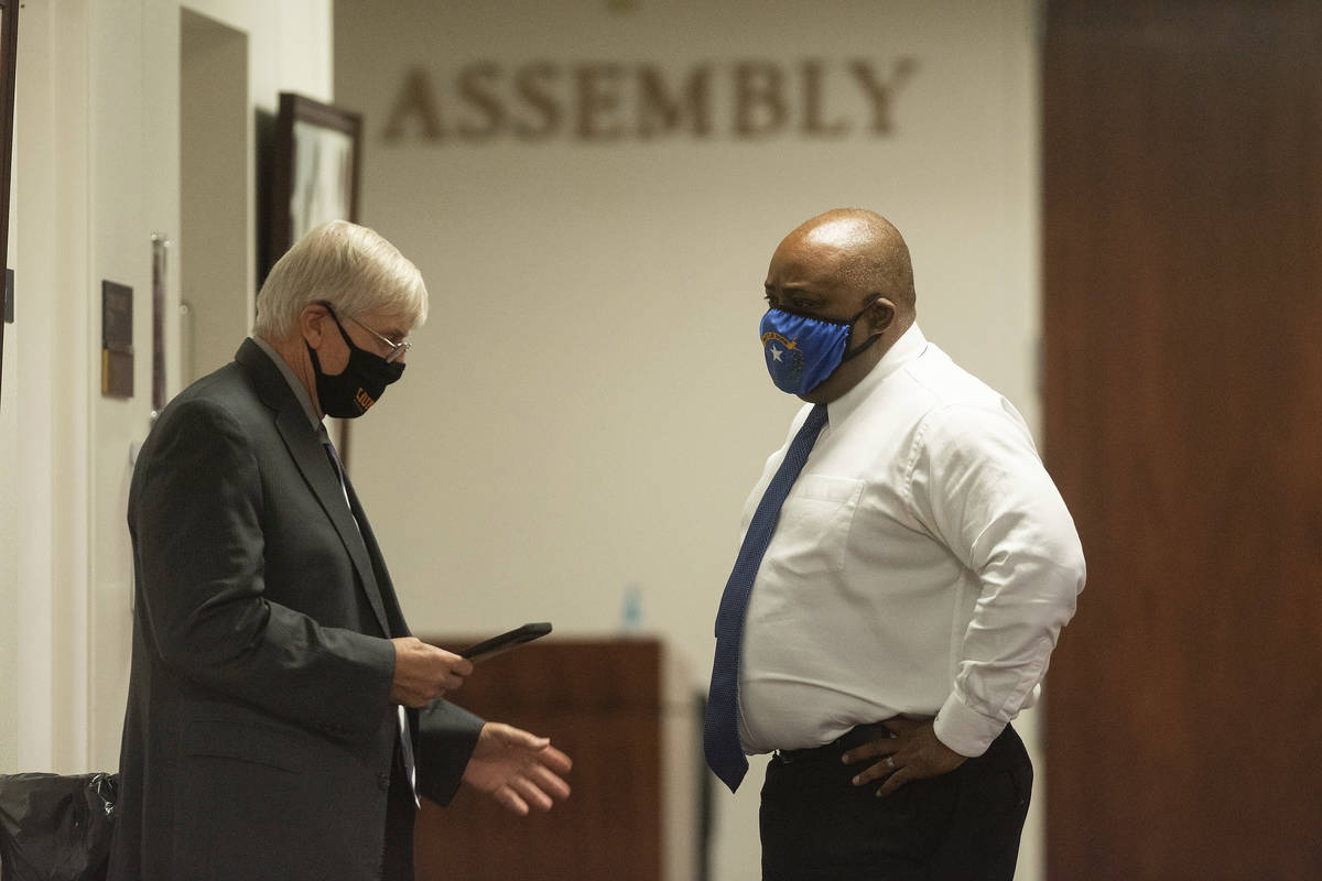 In this July 16, 2020, file photo, Assembly Speaker Jason Frierson, right, speaks with Assembly ...