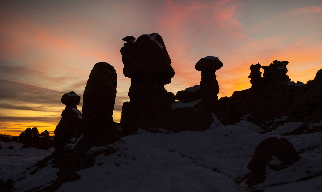 A dramatic sunset behind some of the thousands of hoodoos in Goblin Valley State Park. (L.E. Ba ...