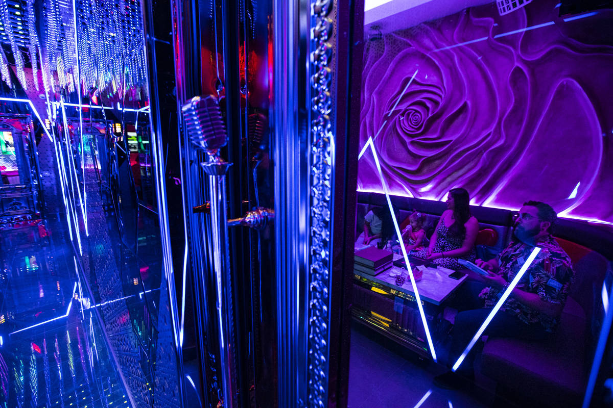 Luzia Borquez, 2, of Las Vegas, second from left, sings to "Let It Go" at Kamu Karaoke at the G ...