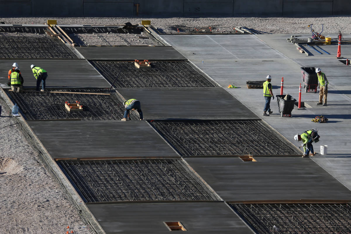Construction of the ground-level field tray at the Raiders Allegiant Stadium in Las Vegas, Thur ...