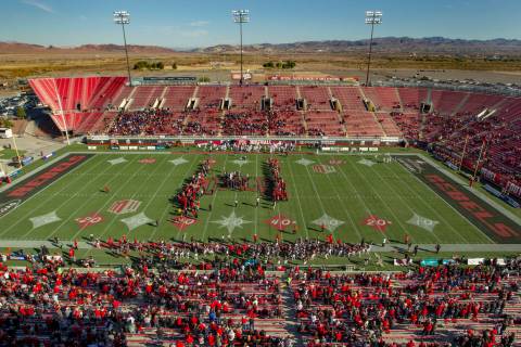 Former UNLV football players come together on the field for the coin toss versus the San Jose S ...