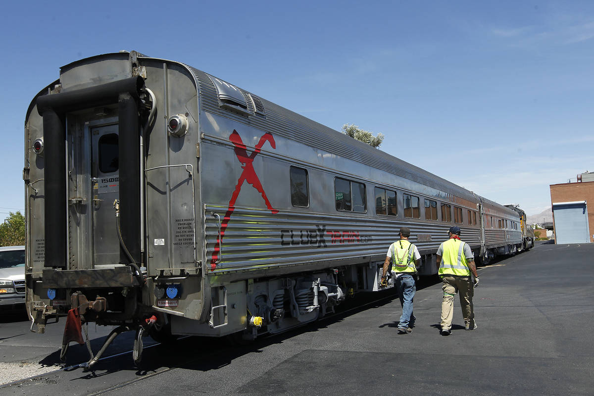 Union Pacific workers prepare a pair of Club X Train cars to be removed from the Las Vegas Revi ...