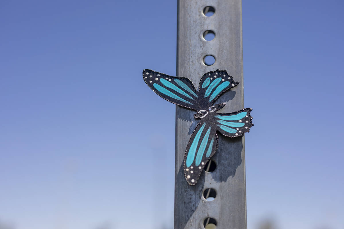 A metal butterfly created by Isaias Urrabazo, a local artist, is pictured in the parking of Mou ...