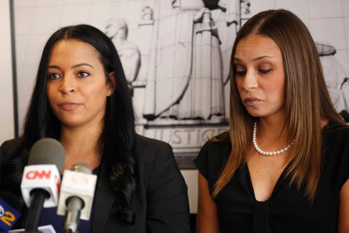 Tasha Schwikert, left, addresses the media next to her sister Jordan Schwikert at the offices o ...