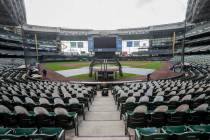 FILE - In this Friday, July 31, 2020, file photo, fan cutouts sit in seats behind home plate at ...