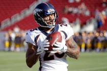 Denver Broncos running back Devontae Booker warms up before the start of an NFL preseason footb ...