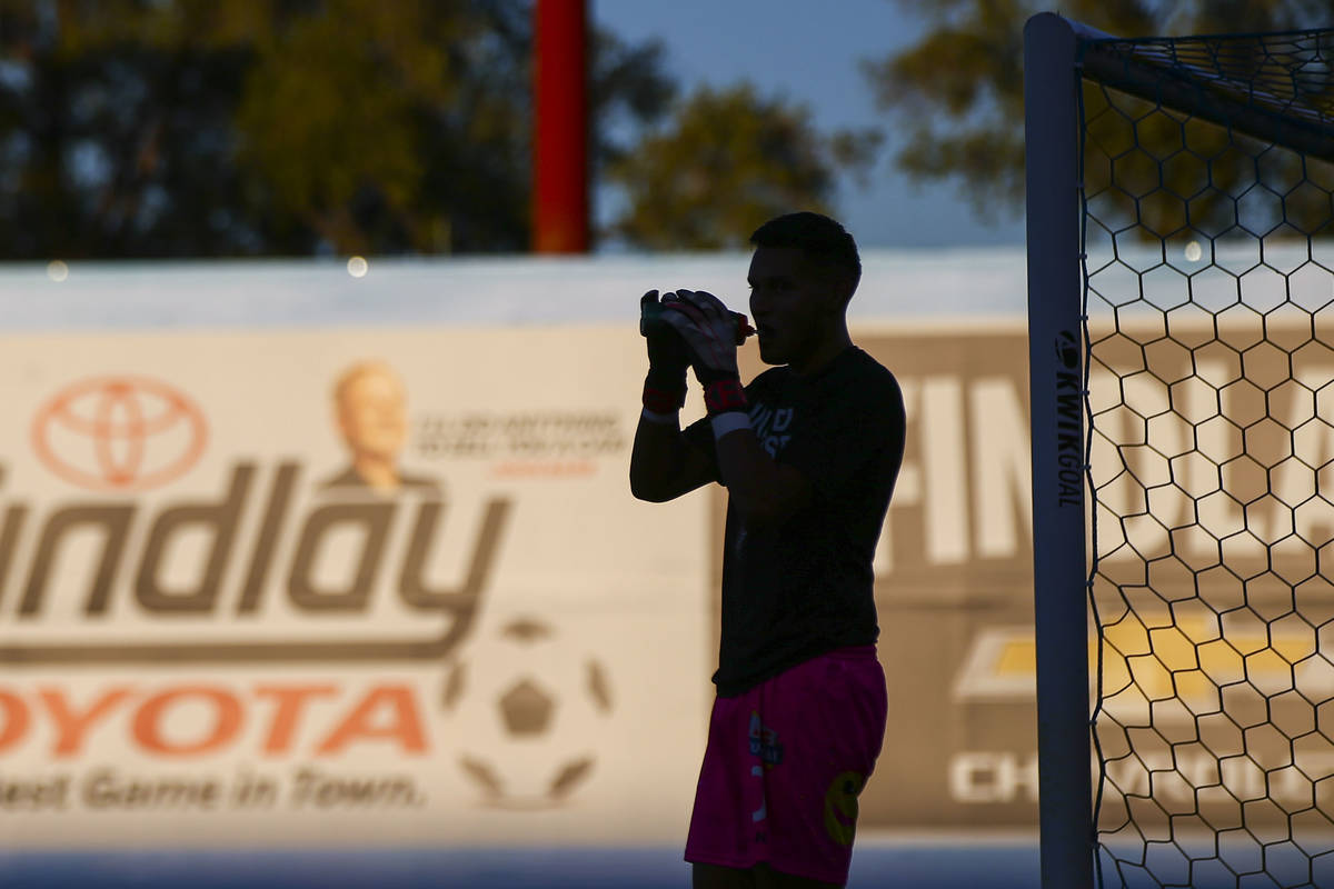 Las Vegas Lights FC goalkeeper Edward Delgado hydrates before the start of a USL soccer game ag ...